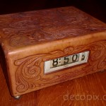 Lawson with tooled leather case. (Clock has dual displays, fron